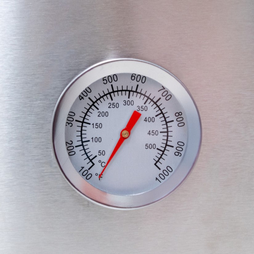 Stainless steel thermometer with a red needle, measuring temperatures up to 1000°F, ideal for monitoring pizza oven heat levels