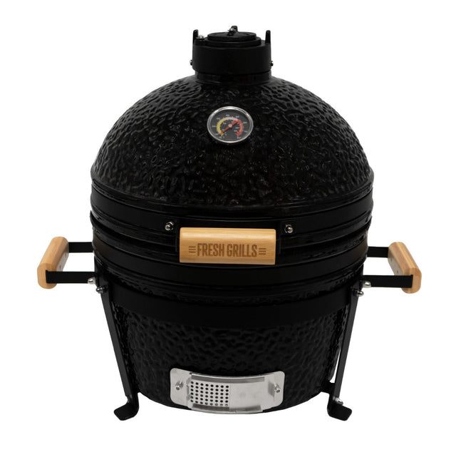 Black 16” Kamado BBQ oven with textured finish, wooden handles, and a temperature gauge, perfect for grilling and smoking food