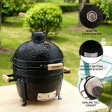 Black ceramic 16” Kamado BBQ oven with textured surface, wooden handles, built-in thermometer, and air flow system, set outdoors