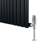 Sleek black oval single column radiator with polished valve, featuring smooth, matte finish and modern design, ideal for stylish heating