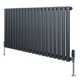 Oval single column radiator in anthracite grey, featuring sleek vertical tubes and polished valves, ideal for modern interiors