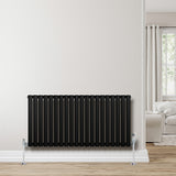 Sleek black oval single column radiator with polished valves, mounted on a light wall, enhancing modern interior decor