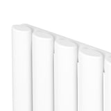 Sleek white oval single column radiator with smooth, rounded edges, designed for efficient heating in modern spaces