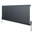 Sleek anthracite grey oval single column radiator with vertical bars and polished valves, measuring 600mm x 1440mm, ideal for modern spaces
