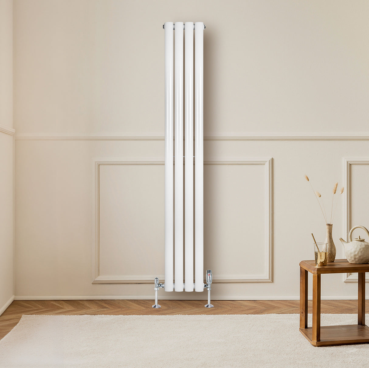 Sleek white oval single column radiator mounted on a wall, complemented by elegant valves, enhancing a modern interior space