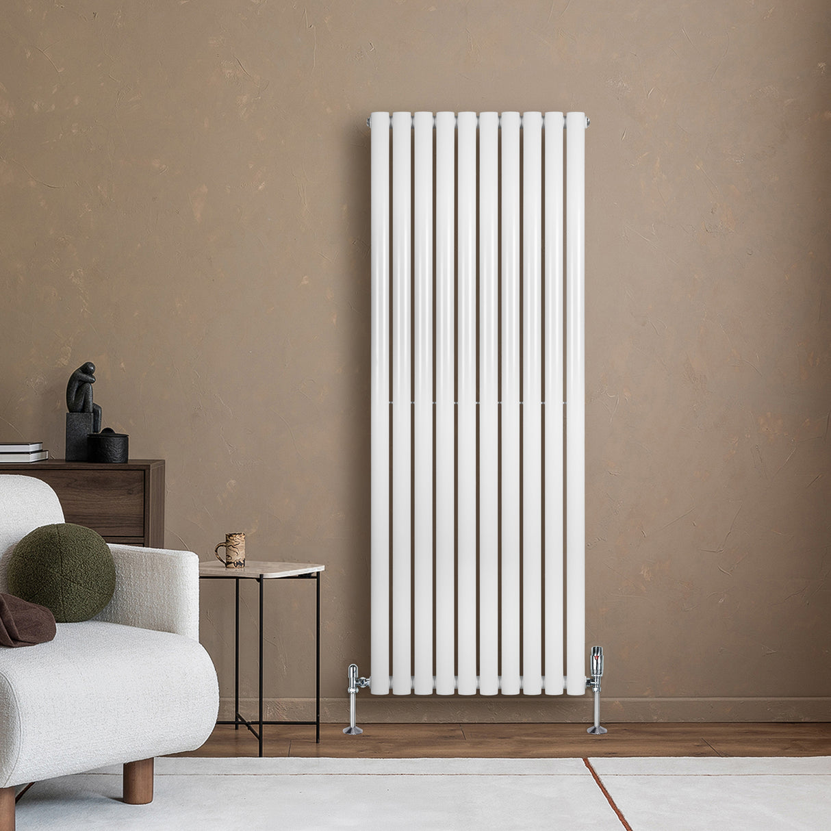 Sleek white oval single column radiator mounted on a textured wall, complemented by modern decor and a cozy sofa setting