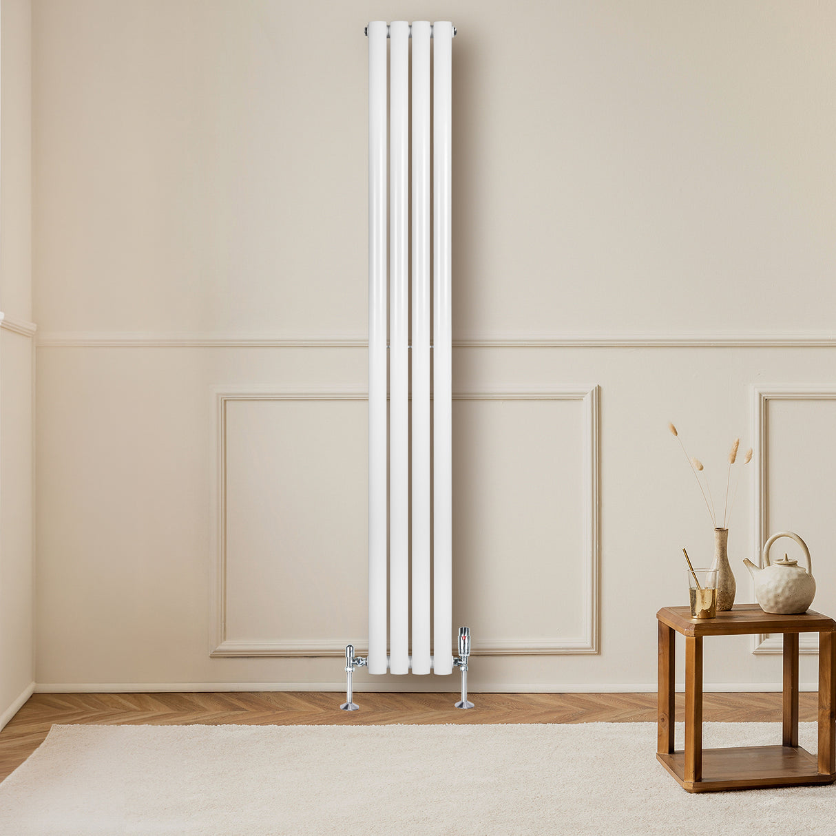Sleek white oval single column radiator with chrome valves, positioned against a light wall, enhancing a modern living space
