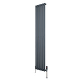 Sleek anthracite grey oval single column radiator with vertical slats, featuring polished valves and a modern design, 1800mm x 360mm