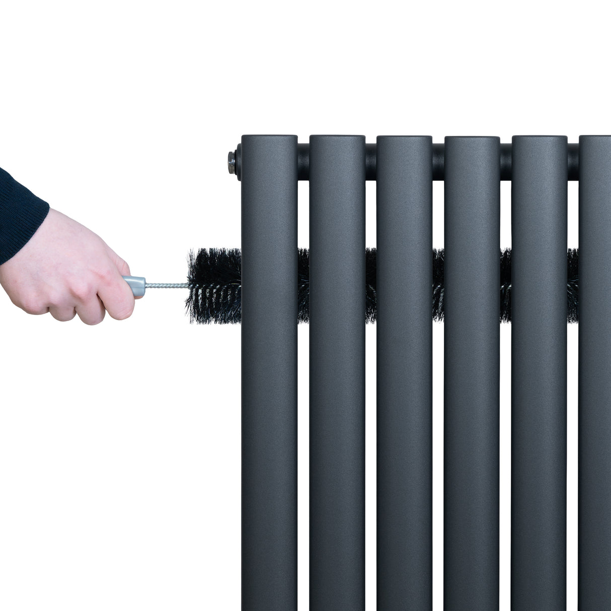 Anthracite grey oval single column radiator with a hand cleaning it, showcasing sleek, modern design and smooth matte finish