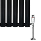 Sleek black oval single column radiator with polished chrome valves, measuring 1800mm x 360mm, ideal for modern interiors