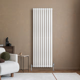 Sleek white oval single column radiator with vertical bars, mounted on a wall, complementing a modern living room setting