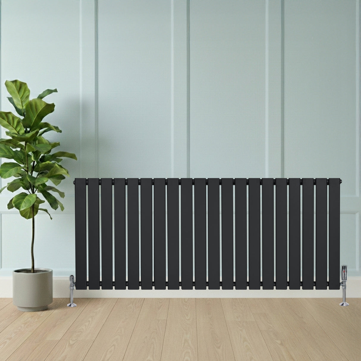 Flat single column radiator in anthracite grey, featuring vertical slats, sleek design, and positioned beside a potted plant on wooden flooring