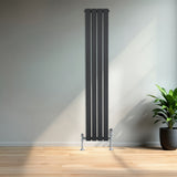 Sleek anthracite grey flat single column radiator with chrome valves, standing tall against a minimalist wall, enhancing modern decor