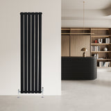 Sleek black flat single column radiator with vertical slats, mounted on a light wall, complemented by stylish valves and modern decor