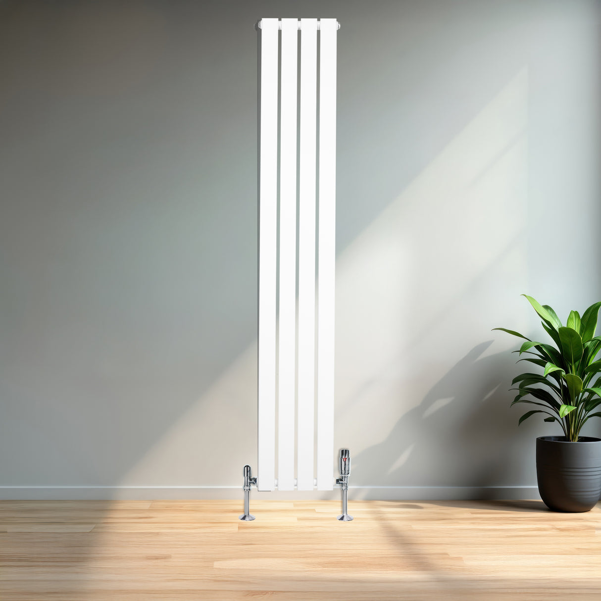 Sleek white flat single column radiator with chrome valves, standing tall against a modern interior backdrop with natural light