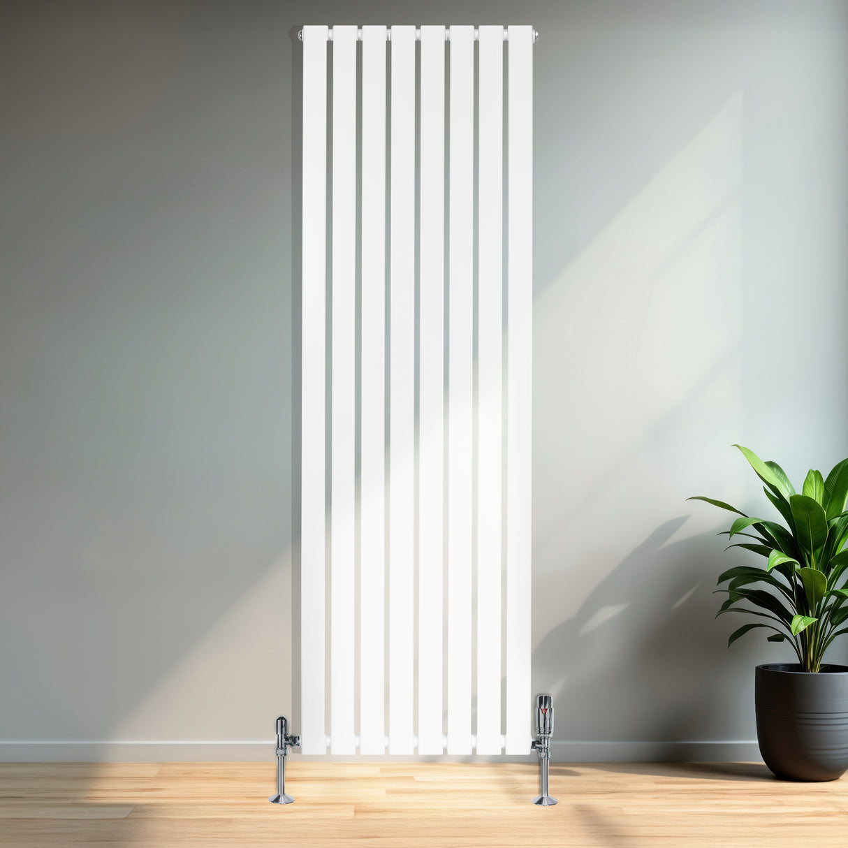 Sleek white flat single column radiator with vertical slats, featuring chrome valves, set against a light wall and wooden floor