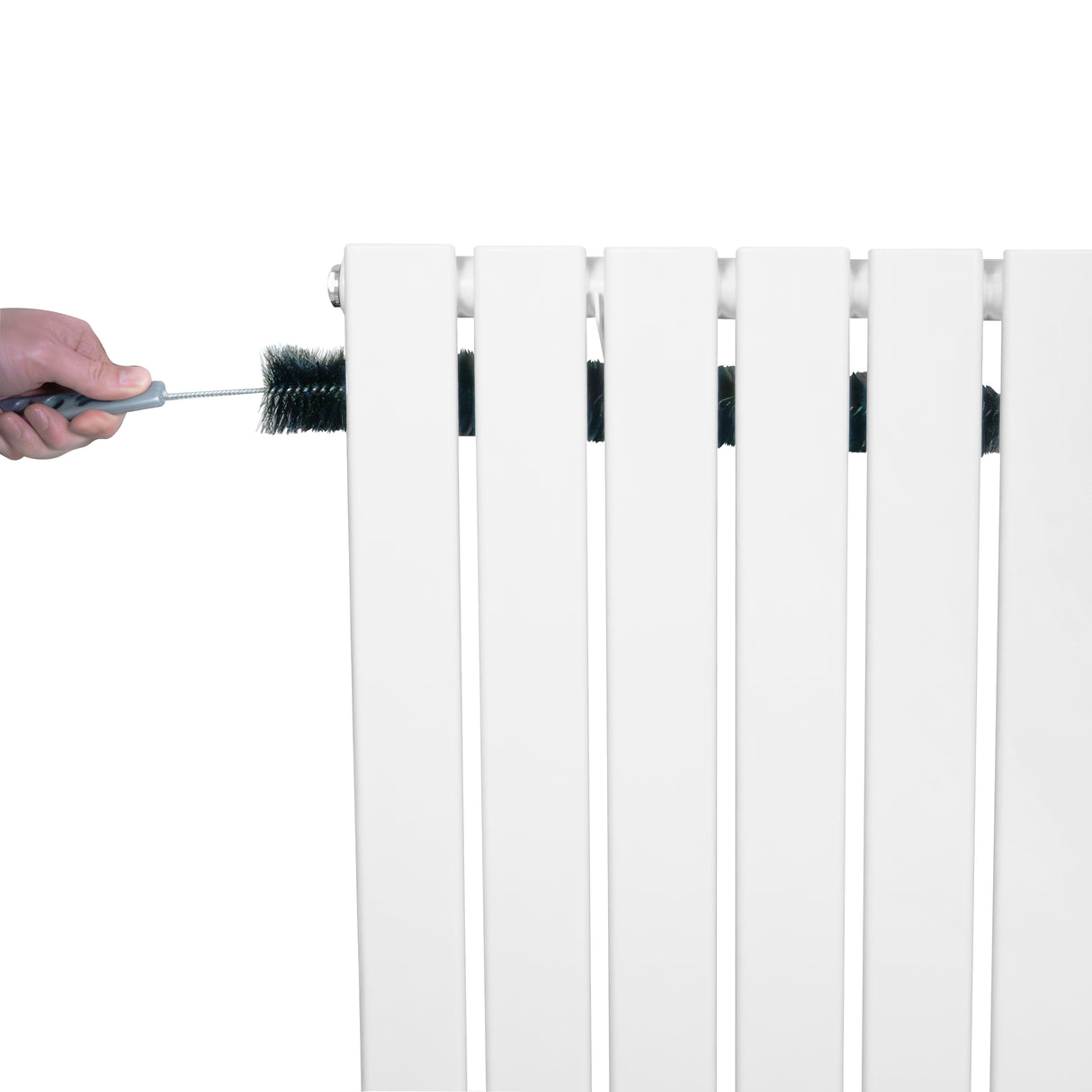 White flat single column radiator with smooth, sleek design, being cleaned with a brush, showcasing its modern aesthetic and functionality