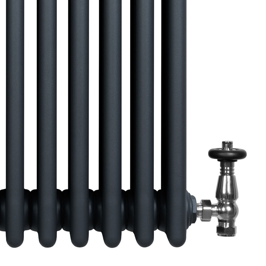 Anthracite grey traditional 4 column radiator with smooth, rounded tubes and a polished valve, ideal for vintage-style interiors