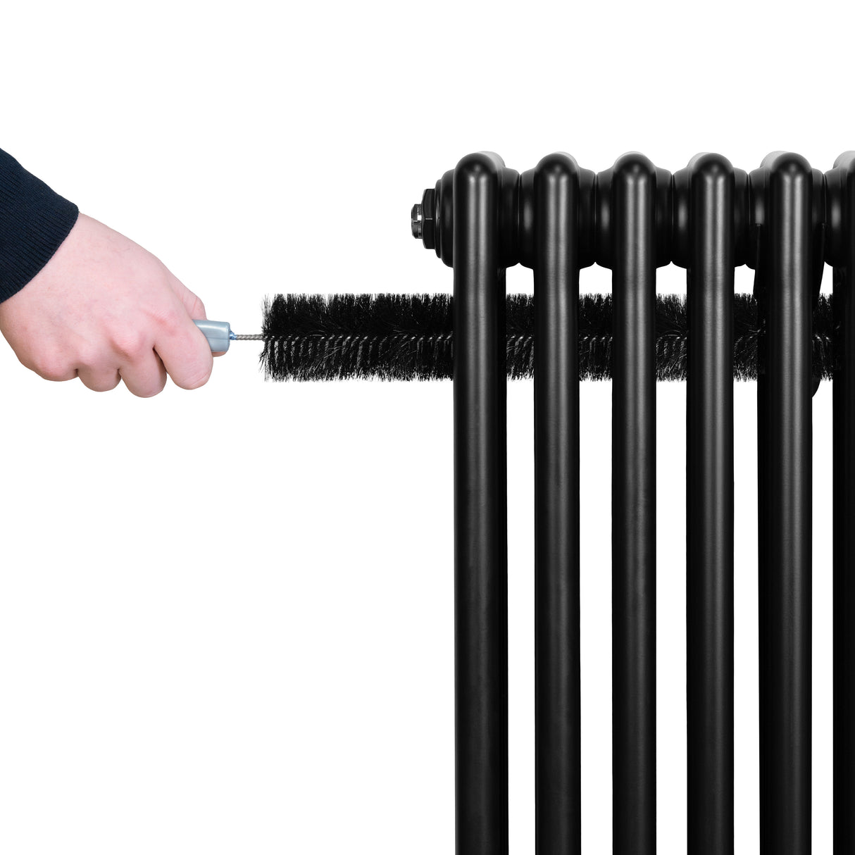Black traditional 4 column radiator with a hand using a brush for cleaning, showcasing its sleek design and smooth texture