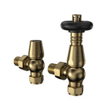 Brass radiator valves with a polished finish, featuring a round black handle and a sleek, modern design for efficient heating systems