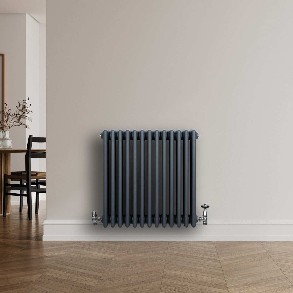 Traditional anthracite grey 4 column radiator with sleek vertical lines, mounted on a light wall, enhancing modern interior decor