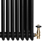 Traditional black 4 column radiator with a sleek finish, featuring a brass valve for efficient heating and elegant design