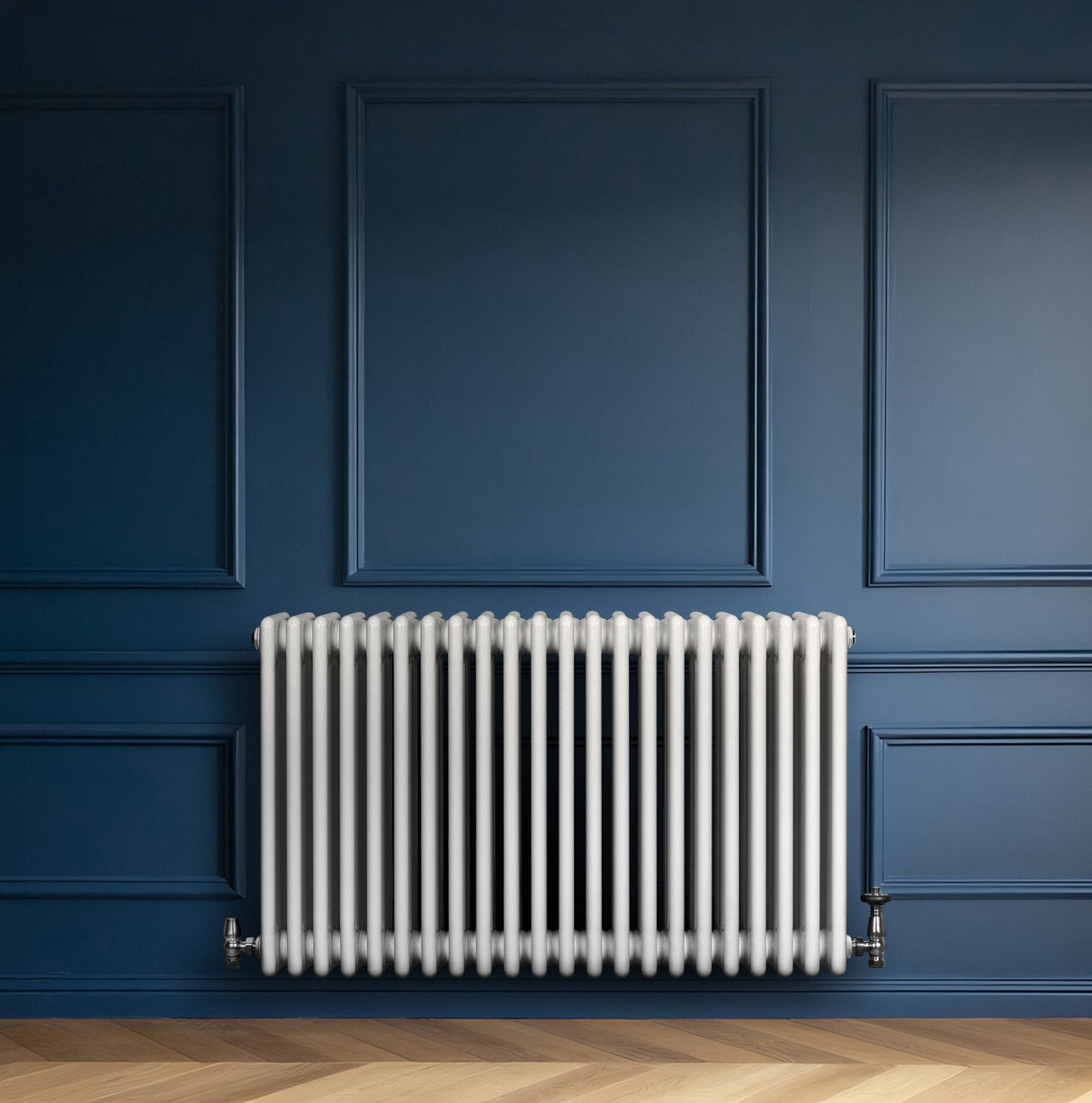 Traditional white 4 column radiator with smooth, glossy finish, mounted against a deep blue wall, enhancing modern decor