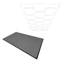 Hexagon LED light design above grey vented garage floor tiles with textured surface and black edges, ideal for modern spaces