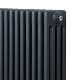 Traditional 4 column radiator in anthracite grey, featuring a sleek, textured finish and a compact design measuring 600 x 1190mm