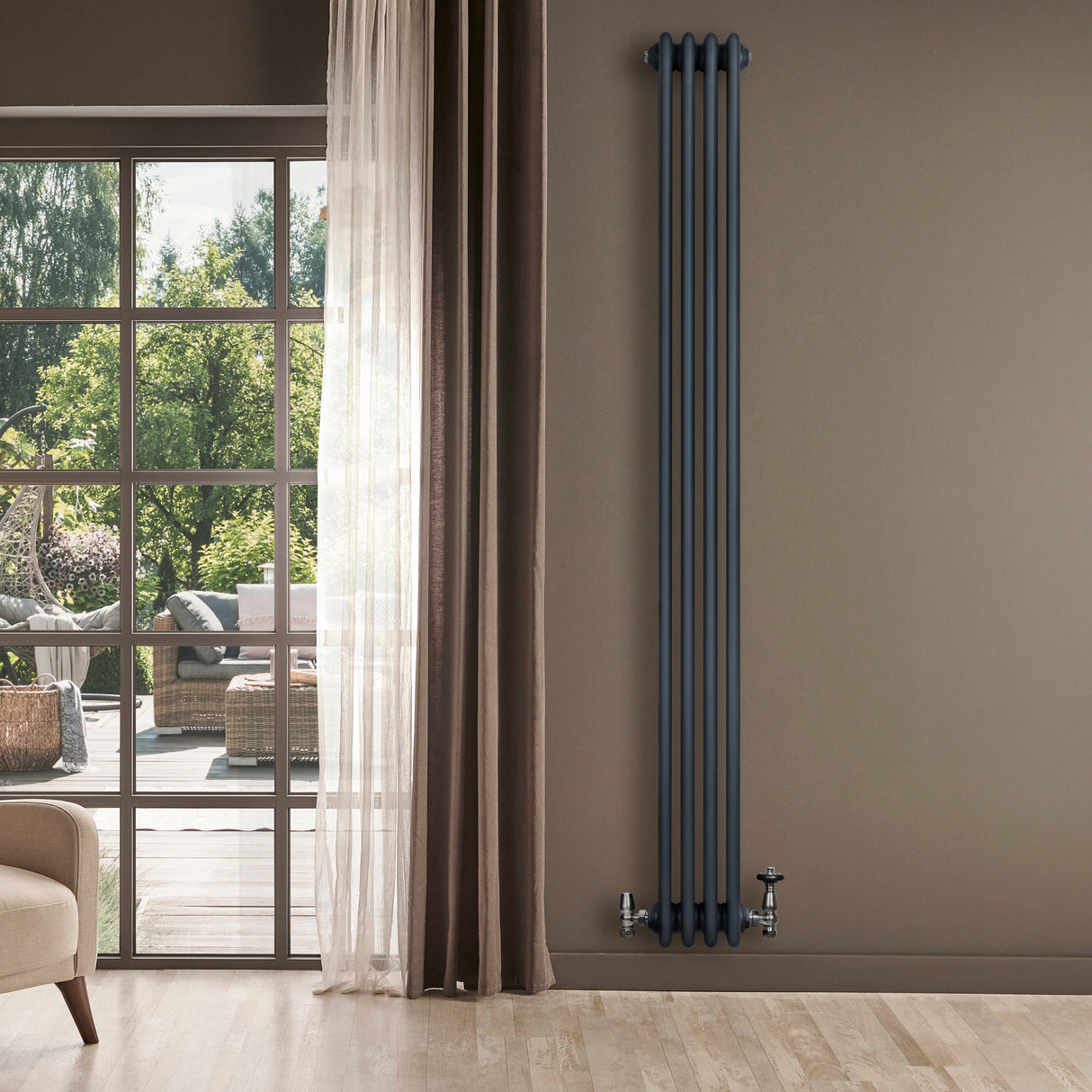Traditional anthracite grey 4 column radiator, 1800 x 200mm, mounted on a wall beside a large window with natural light