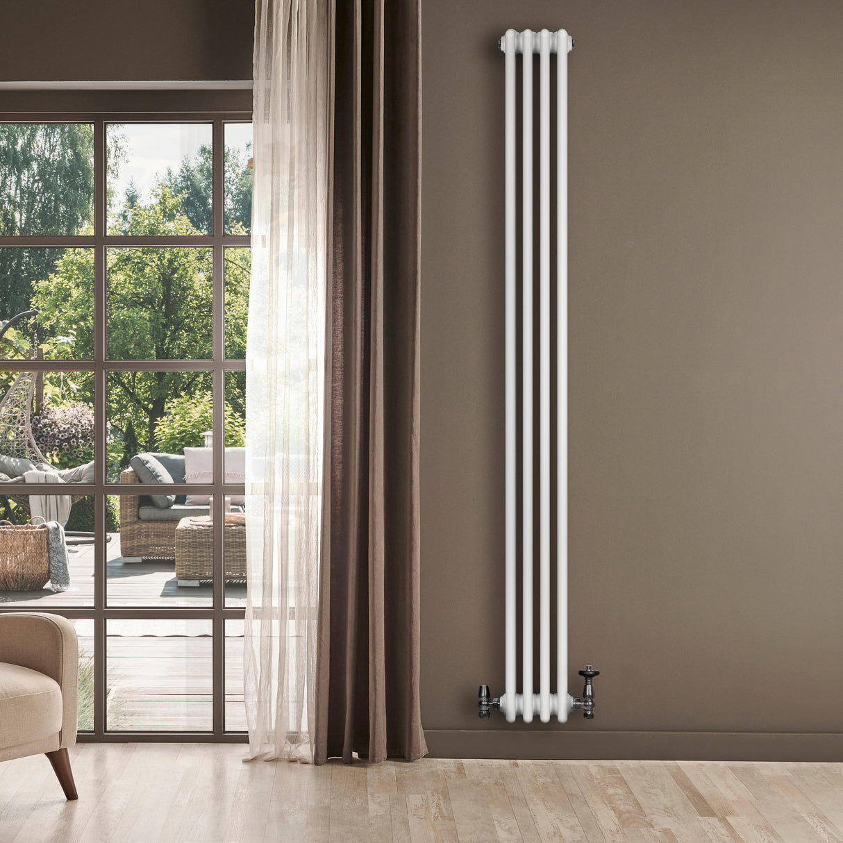 Tall, sleek white traditional 4 column radiator against a warm beige wall, enhancing a bright, modern living space with natural light