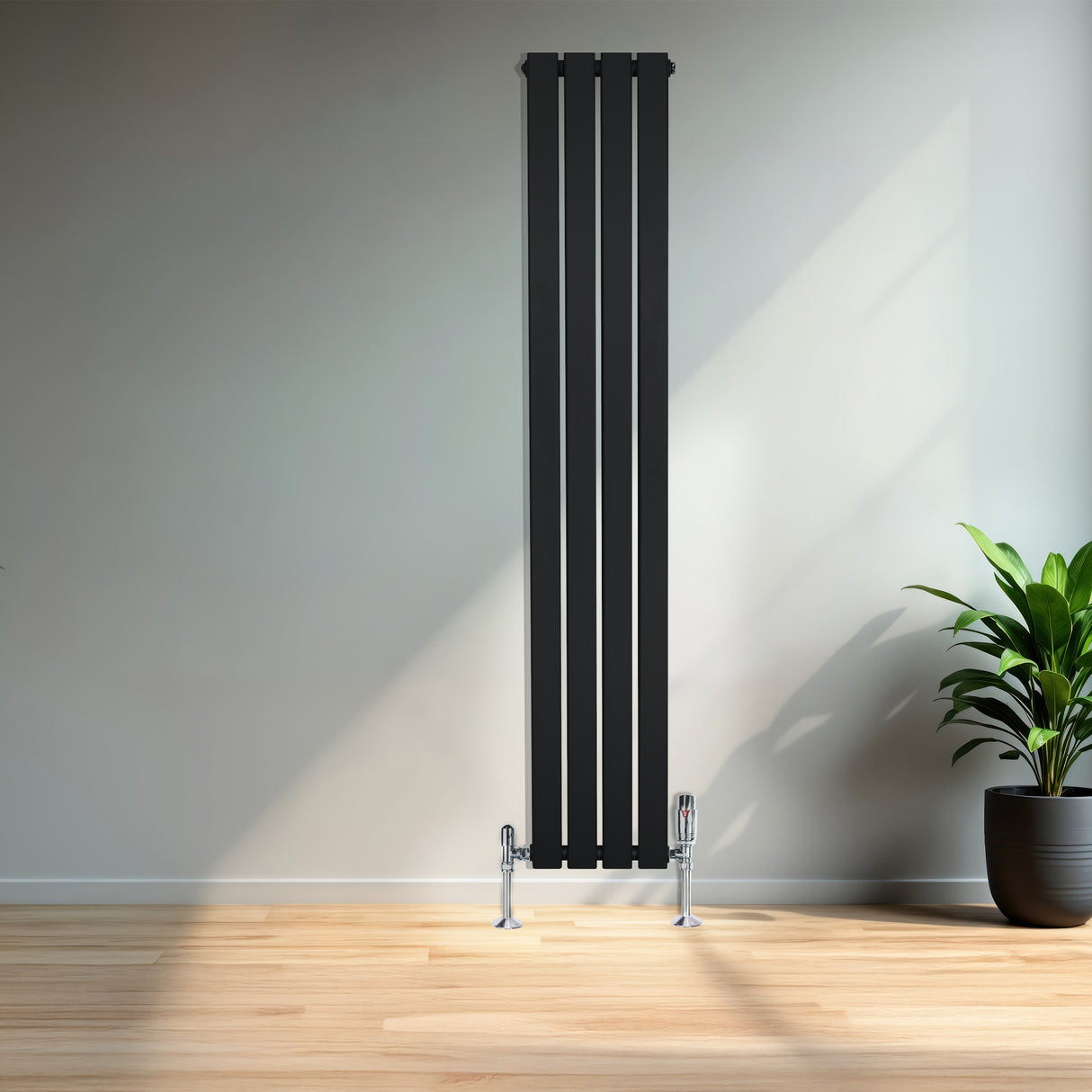 Sleek black flat single column radiator, 1600 x 280mm, mounted on the wall with chrome valves, set against a modern interior backdrop