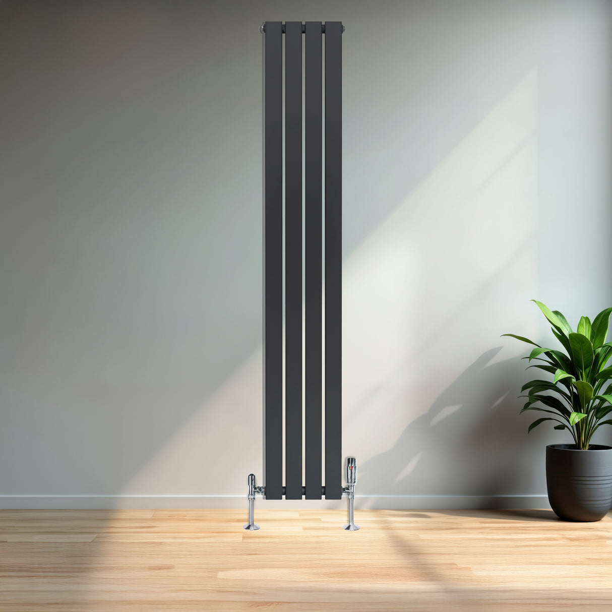 Tall anthracite grey flat single column radiator with sleek vertical lines, mounted on the floor in a modern interior setting