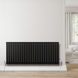 Sleek black oval single column radiator, 600 x 1440mm, mounted on a light wall, enhancing modern interior decor with a minimalist design