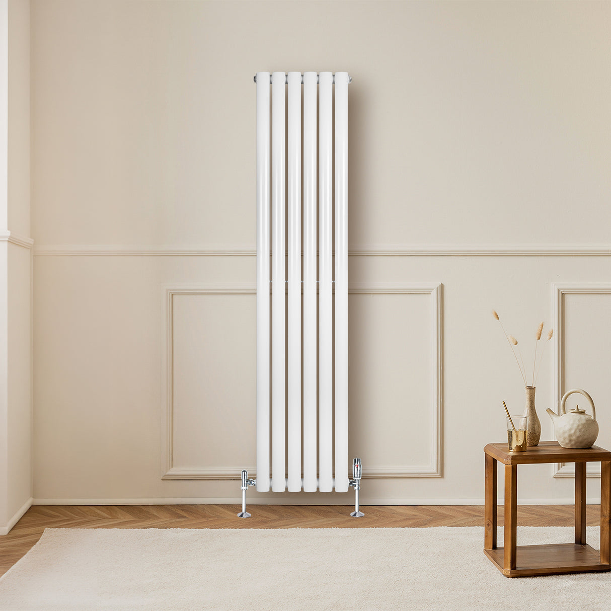 Sleek white oval single column radiator, 1600 x 360mm, mounted on a light wall, enhancing modern interior decor with elegant lines