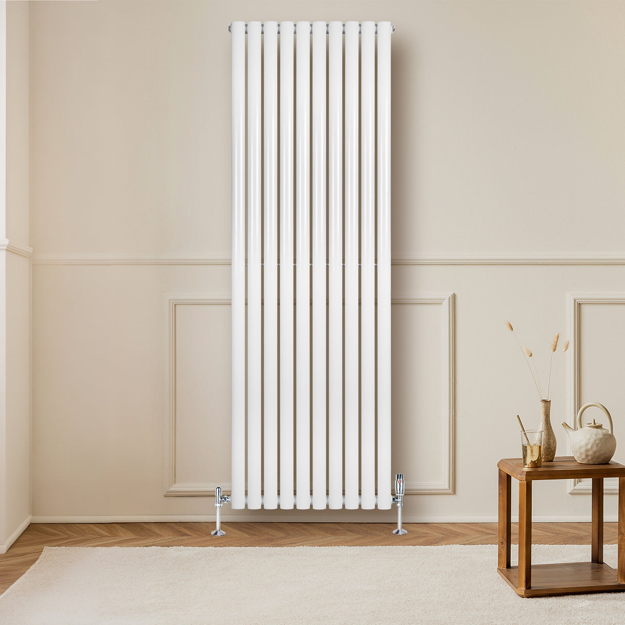 Sleek white oval single column radiator, 1800 x 600mm, mounted on a wall, enhancing a modern living space with warm elegance