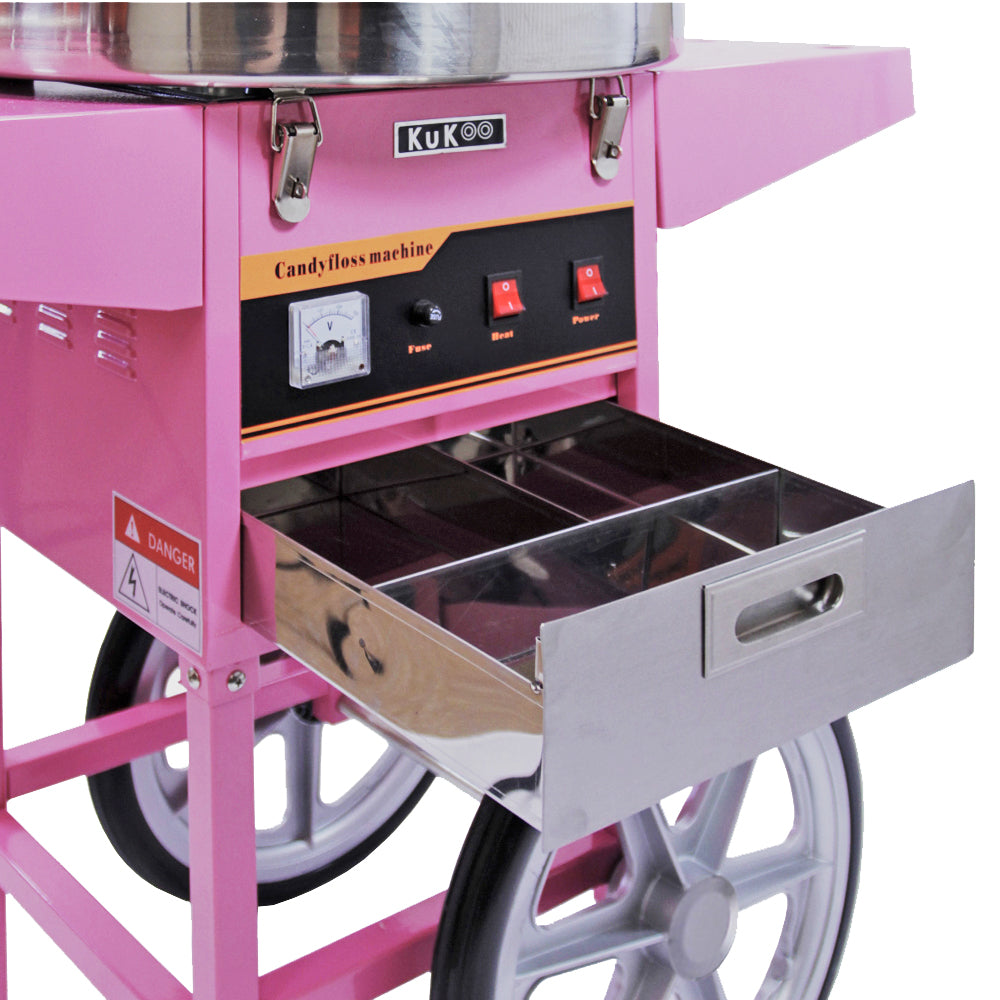 Bright pink candy floss machine with stainless steel drawer, control panel featuring buttons for power and heat, and large wheels for mobility
