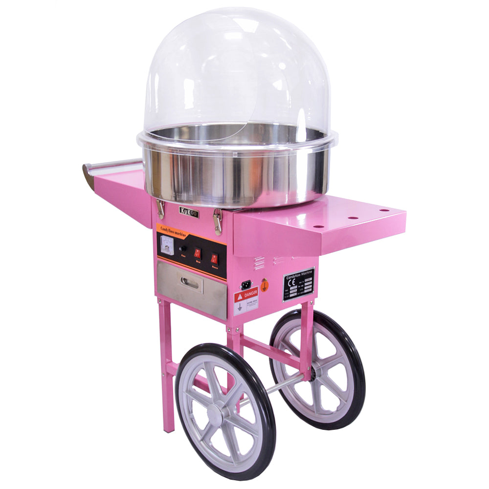 Bright pink cotton candy machine with a stainless steel bowl, clear dome cover, and sturdy wheels for easy mobility