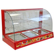 Bright red glass food warmer with three stainless steel trays, wire racks, and a curved glass front for easy visibility of displayed food