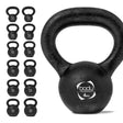 Black cast iron kettlebell with a textured handle, featuring a weight label, displayed among multiple kettlebells of varying weights