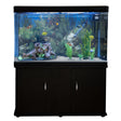 Aquarium fish tank with black cabinet, vibrant aquatic plants, colorful fish, and white gravel creating a lively underwater scene