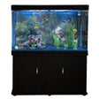 Aquarium fish tank with black cabinet, vibrant blue gravel, lush greenery, and colorful fish swimming in clear water