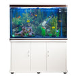 White aquarium fish tank with blue gravel, vibrant plants, and colorful fish, set on a sleek cabinet with storage doors