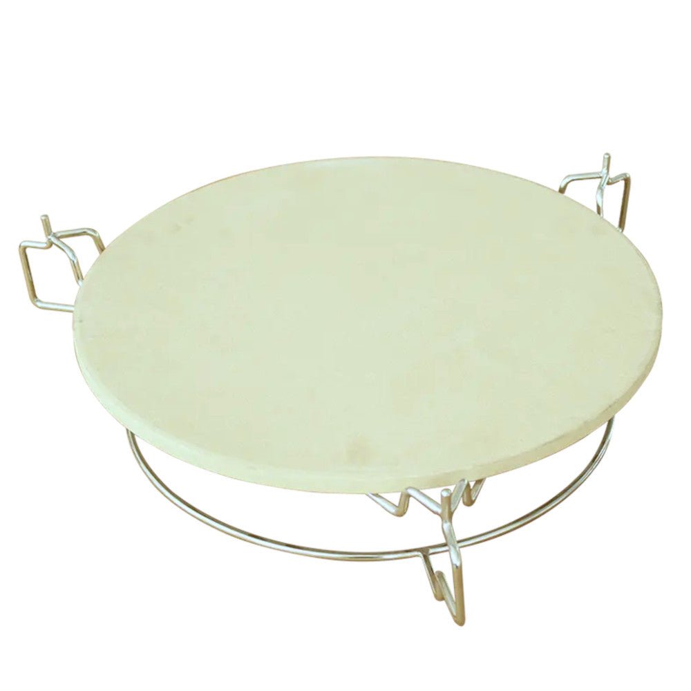 Round, white pizza stone with a stainless steel heat deflector and sturdy wire elevator, designed for Kamado BBQ ovens