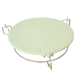 Round, white pizza stone with a stainless steel heat deflector and sturdy wire elevator, designed for Kamado BBQ ovens