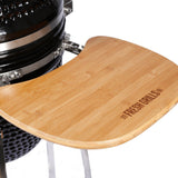 Black Kamado charcoal BBQ grill with a bamboo side shelf, featuring the Fresh Grills logo, showcasing sleek design and sturdy construction