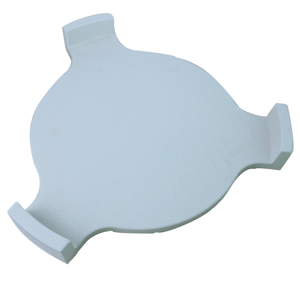 White ceramic heat deflector for Kamado ovens, featuring a smooth surface and curved edges for even heat distribution