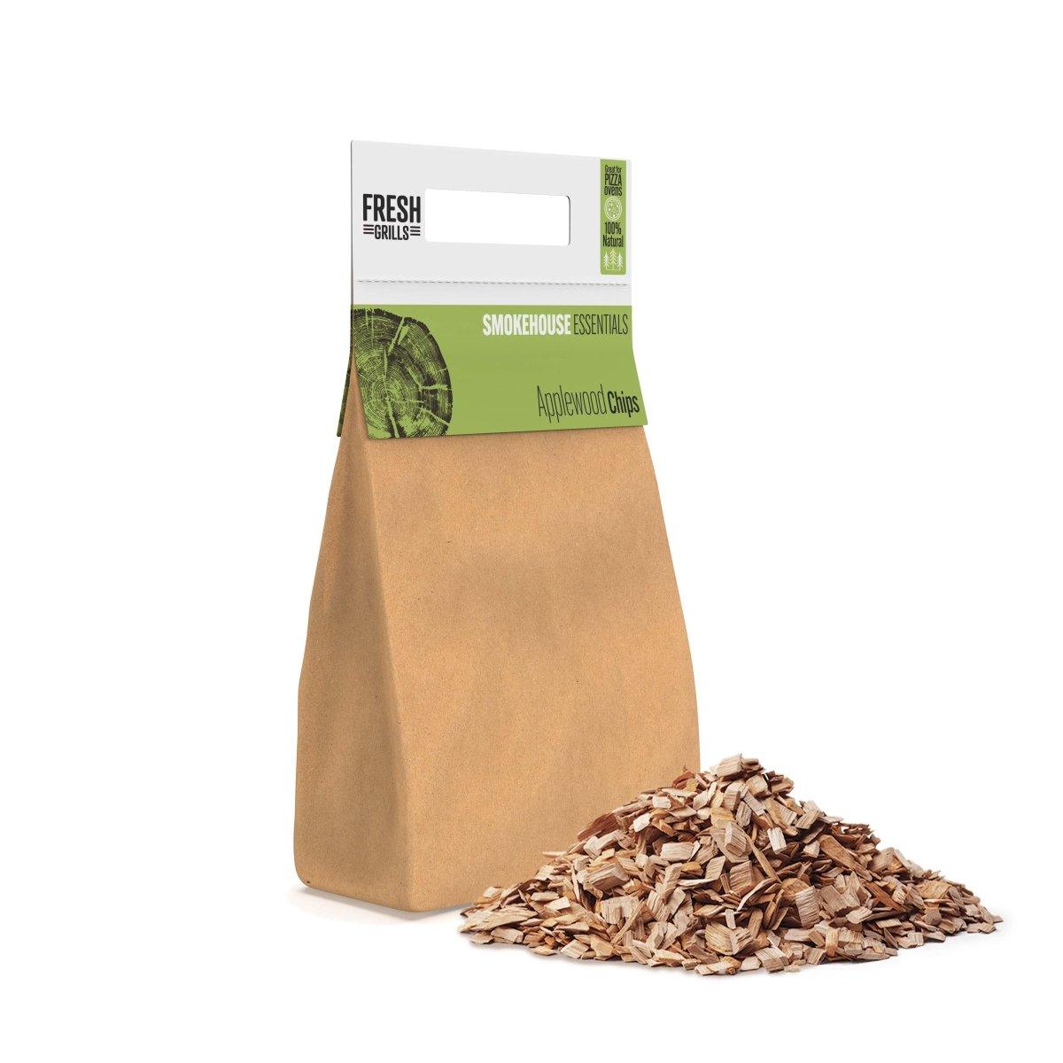 Brown paper bag filled with applewood chips, showcasing a textured pile of wood pieces, ideal for BBQ grills and smokers