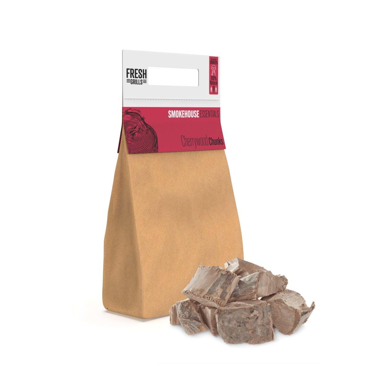 Brown paper bag filled with cherrywood chunks, ideal for BBQ grills and smokers, showcasing a natural wood texture and rich color