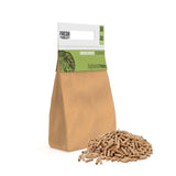 Brown paper bag filled with applewood pellets for BBQ grilling, featuring a green label and scattered pellets on a white background